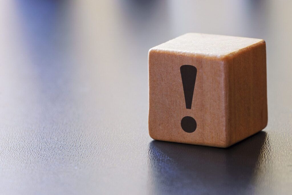 warning exclamation mark on a wooden block 2023 11 27 04 54 00 utc